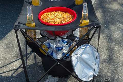 This Clever Tailgate Table Has an Insulated Cooler and Spots for Drinks and Snacks